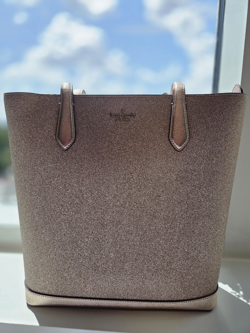 Kate Spade New York Tinsel Tote in a sparkling Rose Gold finish (Style: K9338)